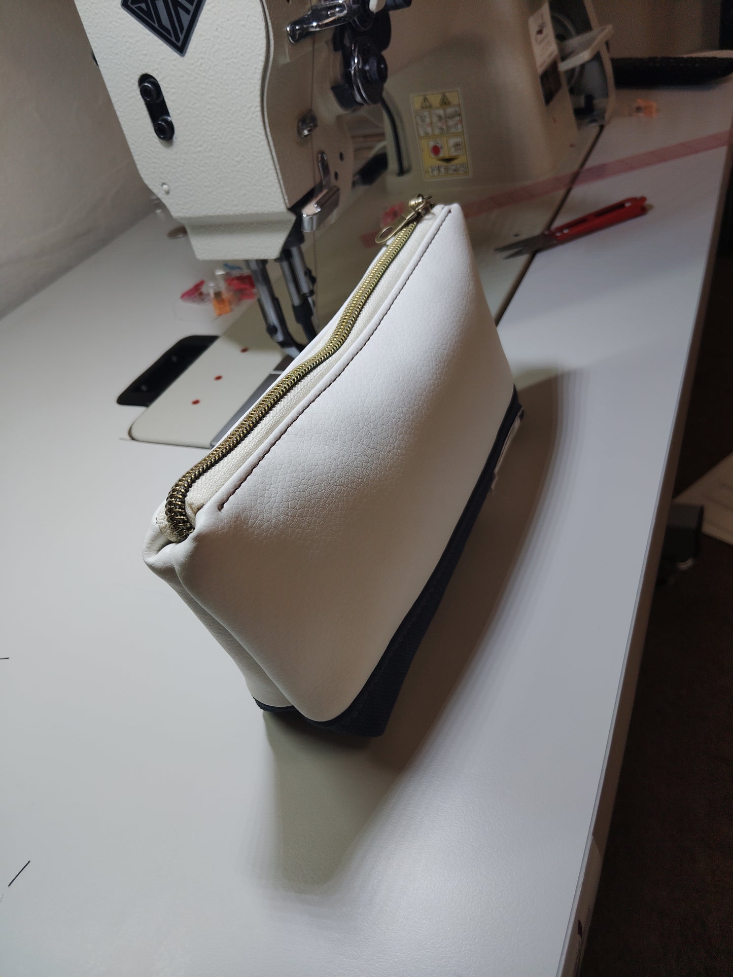 One of a kind- Cream/Snow vinyl leather and navy blue canvas Zip Pouch