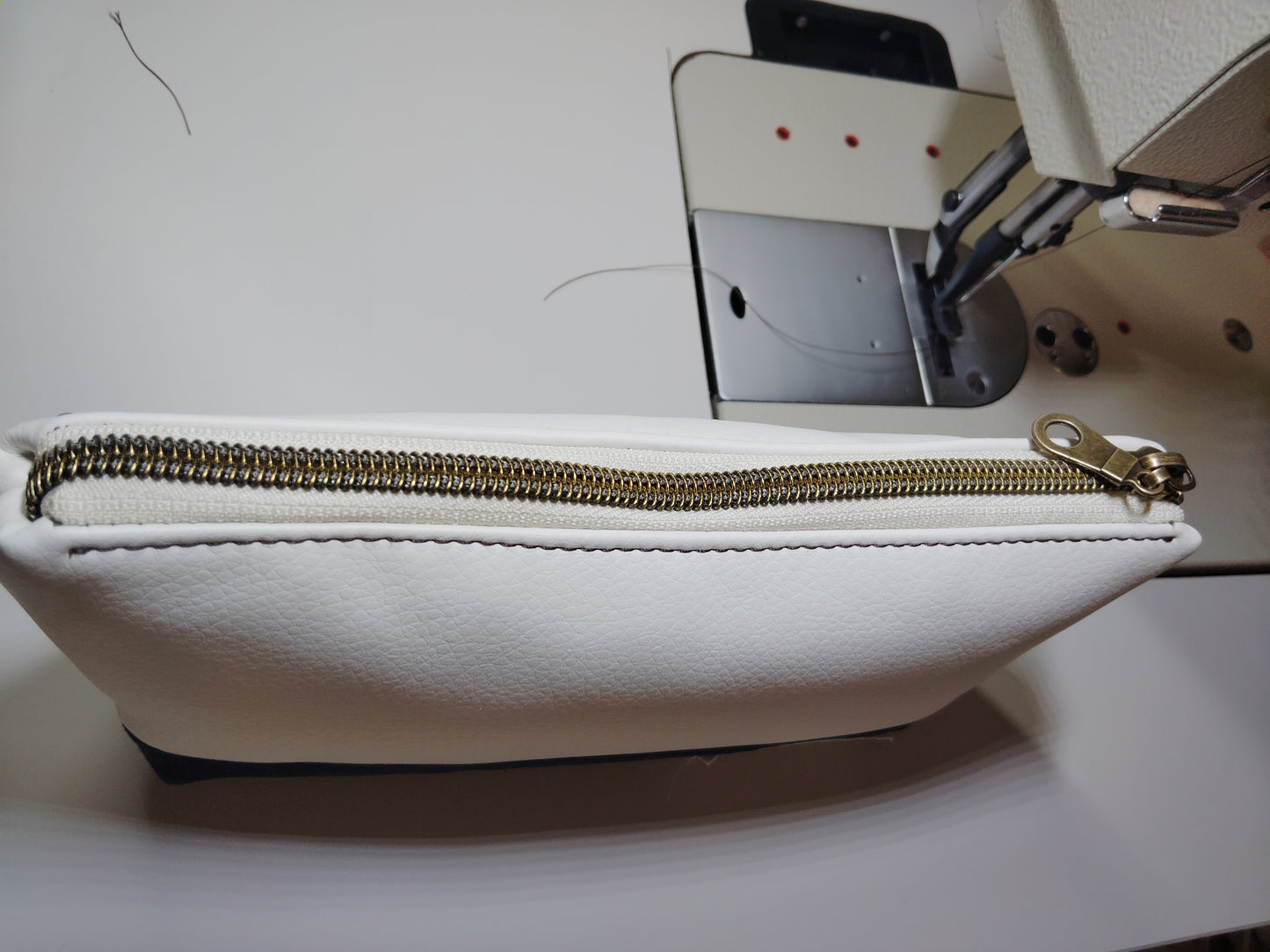 One of a kind- Cream/Snow vinyl leather and navy blue canvas Zip Pouch