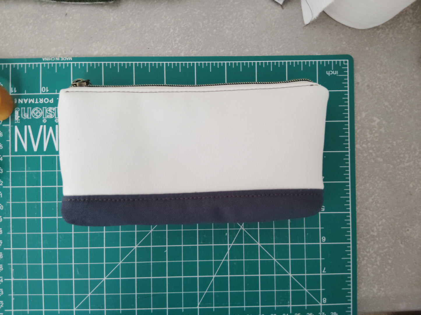 One of a kind- Cream/Snow vinyl leather and navy blue canvas Zip Pouch
